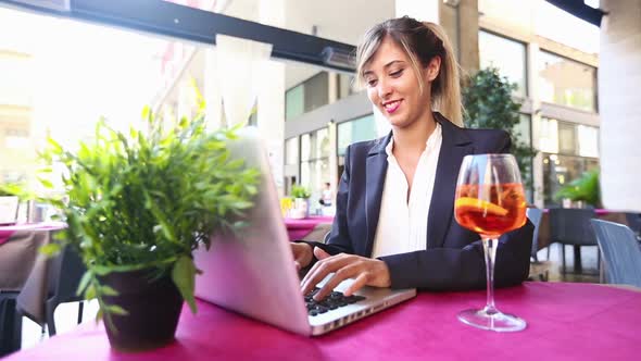 Businesswoman Using Laptop during a Break