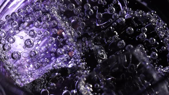 Fizzy bubbles on ice cubes in water