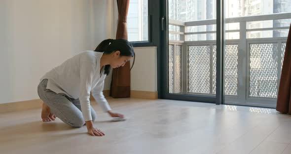 Asian Housewife woman wash the floor with rag