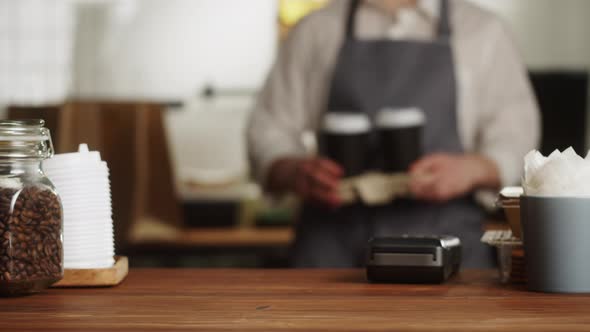 Paying with Smartphone Closeup Using NFC Technology in a Restaurant