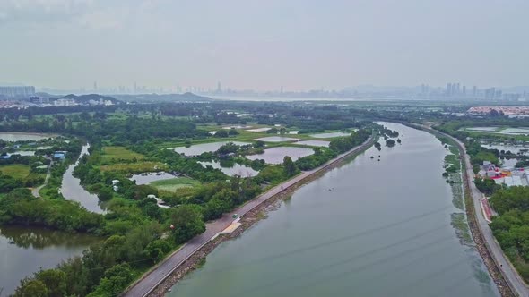 A dynamic descending aerial footage of the green farm in Yuen Long, Hong Kong. This farm is surround