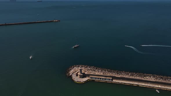 Aerial footage of sailboat sailing in high winds. Yacht racing at mediterranean sea.