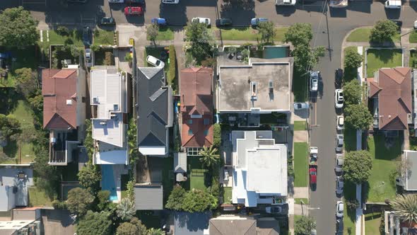 Aerial top down view of houses and streets in beautiful residential neighbourhood during fall season