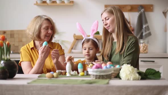 Happy Easter Family Elderly Grandmother and Young Woman Mother Blonde with Little Daughter with