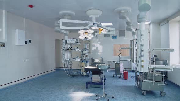 Modern surgical room with technology and lamps