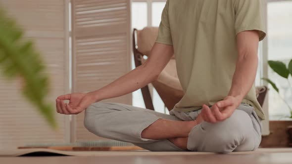 Concentrated Man Meditating In Lotus Pose