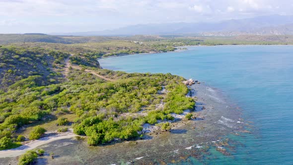 Aerial View of Playa Monte Rio, Azua, Rugged Beautiful Coastline, Coral Reef and Turquoise Blue Ocea