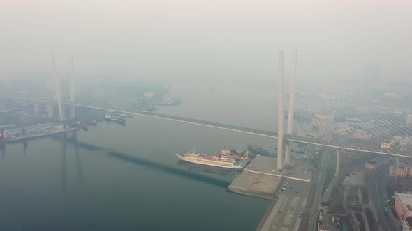 Drone View of the Golden Bridge and the City at Dawn in Heavy Smog