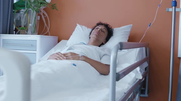 Female patient lying in a hospital bed