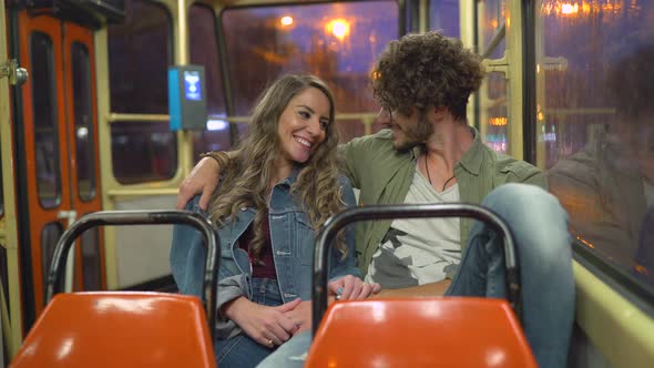 Young couple riding the tram alt