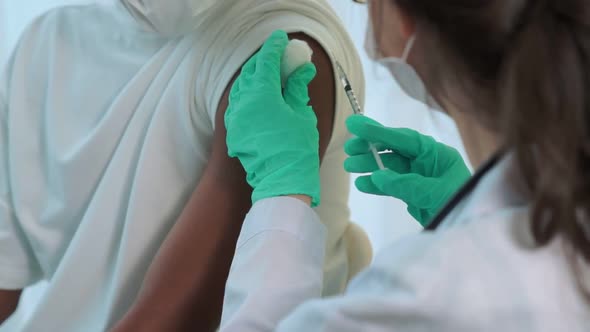 Young Man Visits Skillful Doctor at Hospital for Vaccination