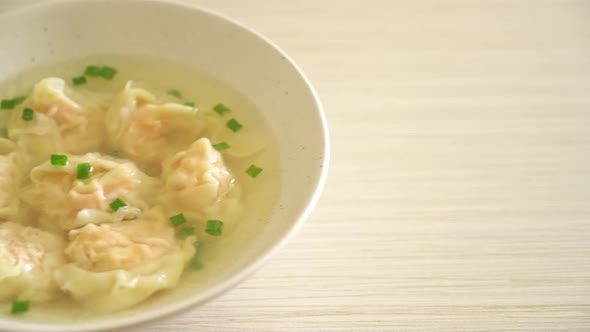 shrimp dumpling soup in white bowl - Asian food style