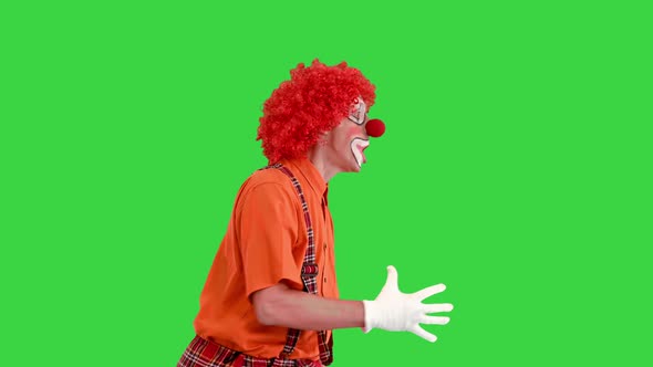 Funny Clown Rushing Somewhere Walking Fast Almost Running on a Green Screen Chroma Key