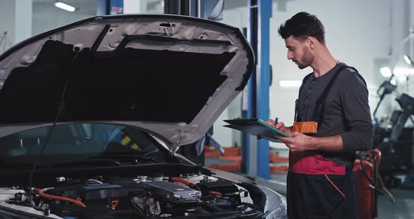 Concentrated Mechanic Man in a Uniform