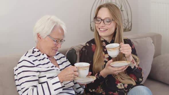 Holidays with Family. Mother and Daughter or Granny and Granddaughter Having the Tea Together 