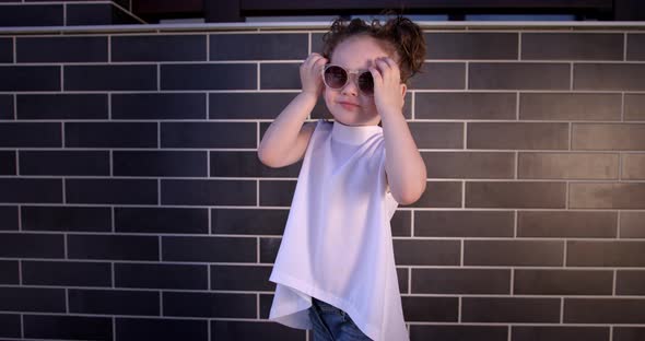Little Girl Presents Designer Summer Clothes And Accessories