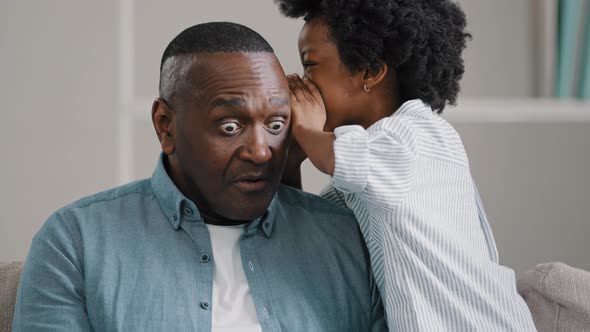 Little African American Girl Whispers in Ear Reveals Secret to Daddy Daughter Shares Secrecy Gossip