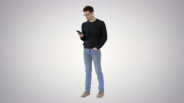 Man with Glasses Suffering with Cough and Using His Phone on Gradient Background