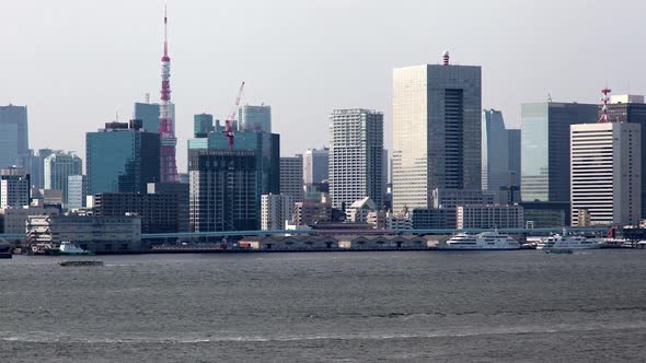 Timelapse Tokyo Motorboats Sail Along River at Minato City