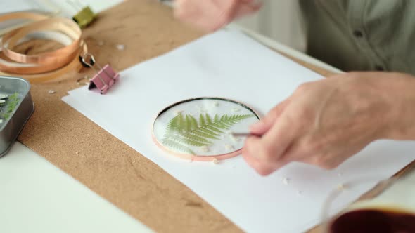 Woman Fixes Glass Plates