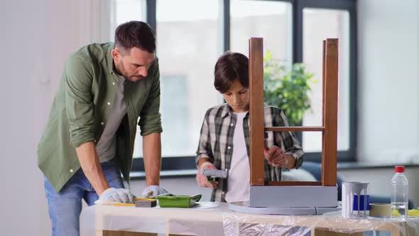 Father and Son Painting Old Table in Grey Color