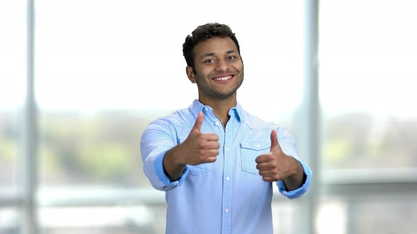 Young Happy Indian Man Showing Thumbs Up with Both Hands