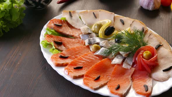 Seafood on Plate  Salmon Herring Fish and Sliced Fish Fillet