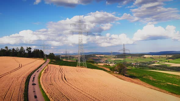 Electric power transmission towers at countryside