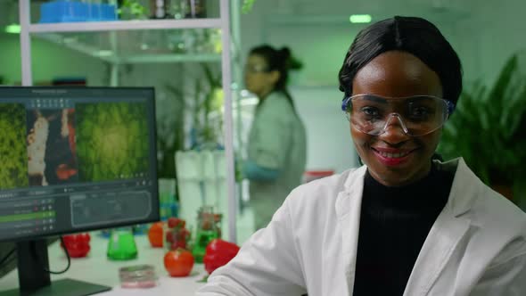 Portrait of Botanist African Woman Working in Microbiology Laboratory