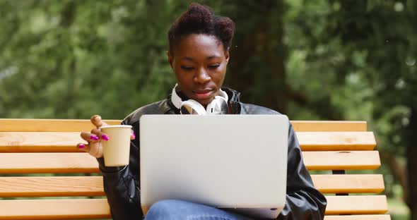 Woman with Laptop in the Park alt