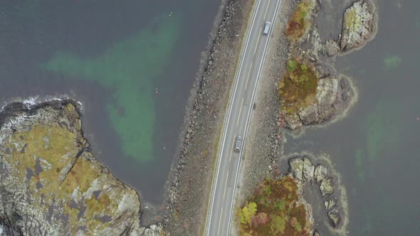 Bird´s Eye View Of Cars Driving On Storeseisund Bridge in Atlantic Ocean Road, Norway. - aerial dron