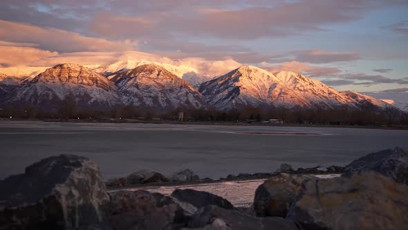 Panning view over the ice on Utah Lake looking at the Wasatch Mountains