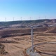 Boundless Fields with Shrubs and Road Against Wind Turbines - VideoHive Item for Sale