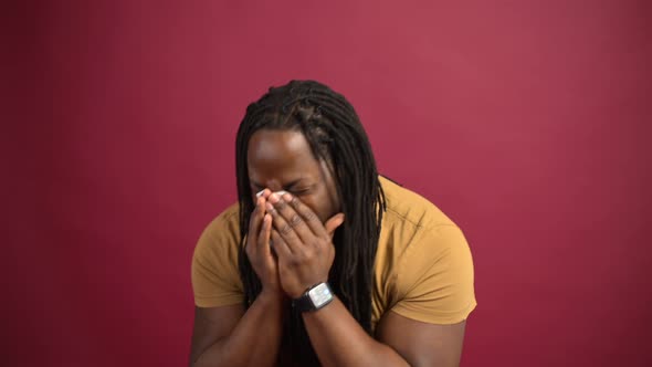 Sick AfricanAmerican Guy Isolated on Red Background