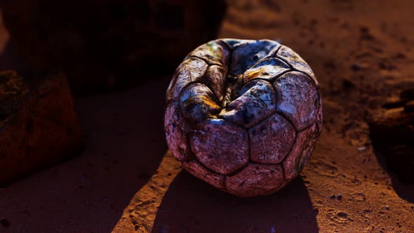 Old Leather Soccer Ball Abandoned on Sand