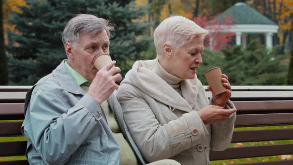 Carefree Elderly Grandparents Drinking Hot Coffee Tea Outdoors Senior Aged Couple Man Woman