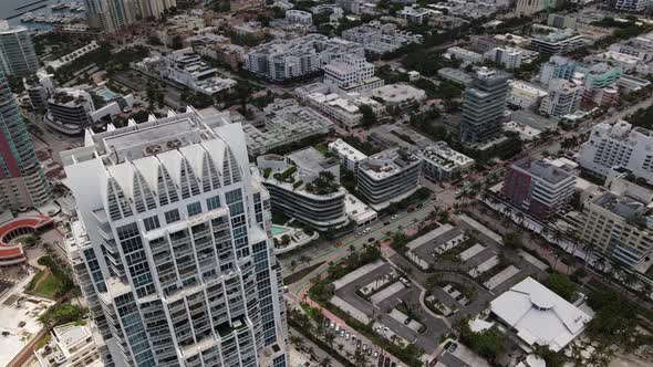 Aerial drone video rooftop flyover Miami Beach highrise architecture