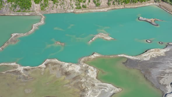 Drone View of the Turquoise Lake Formed As a Result of Mining Waste