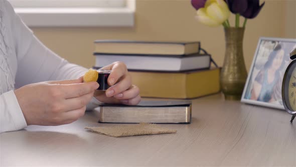 Christian Woman Praying and Taking Communion