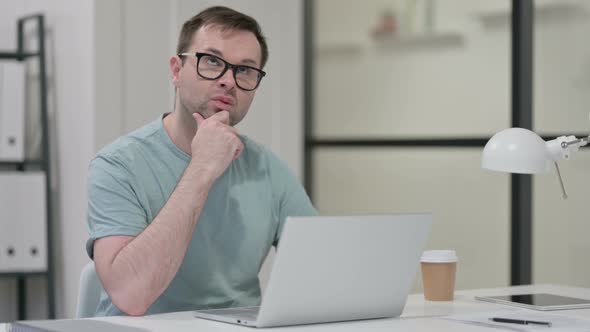 Young Man Laptop Thinking Work