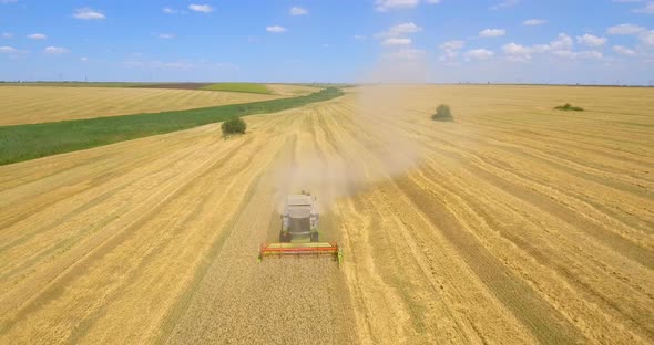 Aerial Shot of Combine Harvester Working in Field