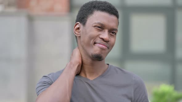 Portrait of Tired Young African Man Having Neck Pain