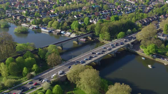 Aerial footage looking over a busy transport section of the UK road network and rail lines