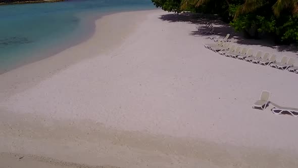 Drone view texture of shore beach trip by blue water and sand background