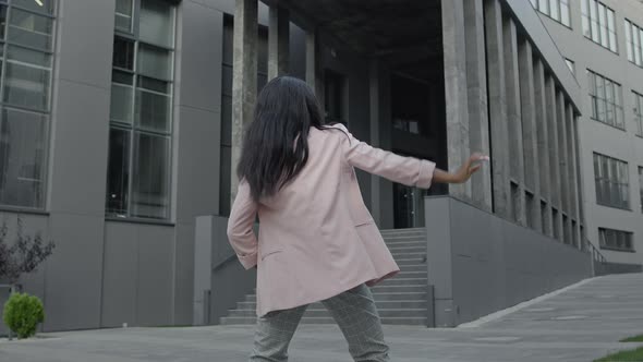 Slender Black Girl Dancing On The Street