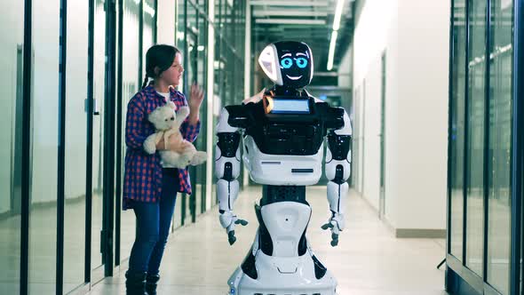 Little Girl Walking Alongside a Futuristic Robot