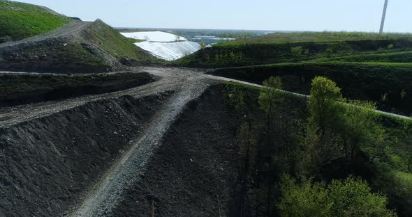 Landfill seen from drone perspective, camera moving around.