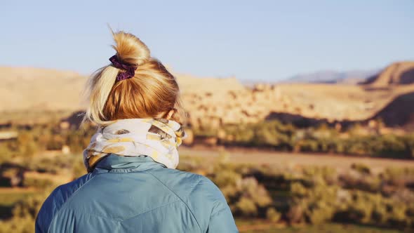 Tourist In Desert And Looking At Ait Benhaddou