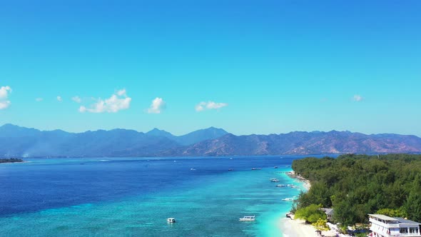 Luxury overhead island view of a white paradise beach and blue ocean background in colorful