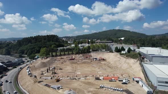 Construction Workers Working on a Building Site of New Residential Building